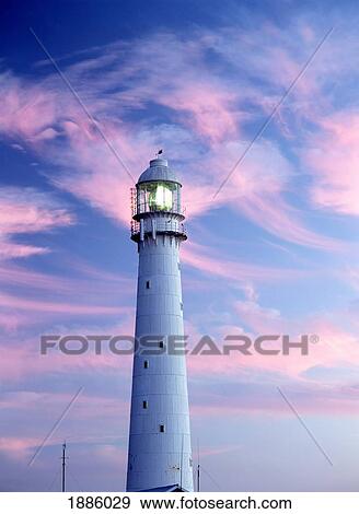 Stock Photo - Clouds Above Lighthouse At Dusk. Fotosearch