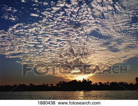 Stock Photo - Clouds And Sky At Sunset Over The Nile River. Fotosearch