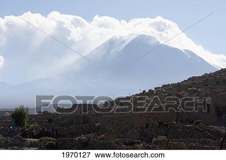 Clouds Over Aucanquilcha Volcano, Antofagasta Region, Chile View Large Photo Image Stock Photo - Clouds Over Aucanquilcha Volcano, Antofagasta Region, Chile. Fotosearch