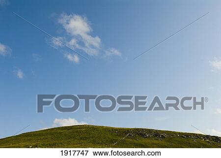 Stock Photo - Clouds Over Hill. Fotosearch