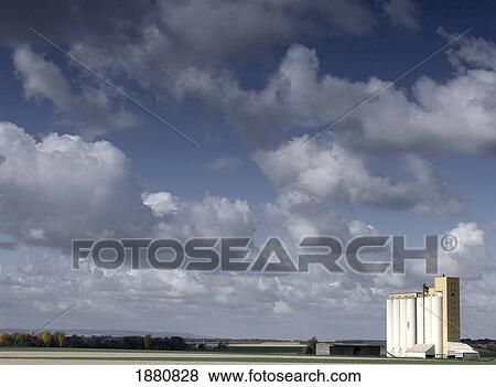 Cloudy Sky Over Grain Farm View Large Photo Image Stock Photo - Cloudy Sky Over Grain Farm. Fotosearch