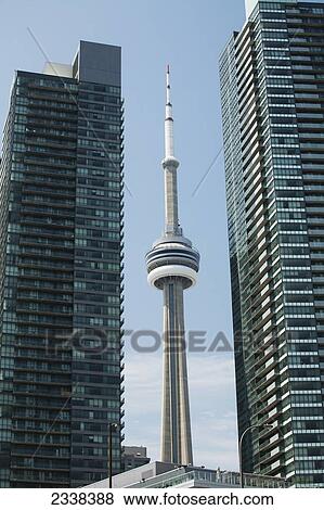 Cn Tower Framed Between Two Skyscrapers And Blue Sky; Toronto, Ontario, Canada View Large Photo Image Stock Photo - Cn Tower Framed Between Two Skyscrapers And Blue Sky; Toronto, Ontario, Canada. Fotosearch