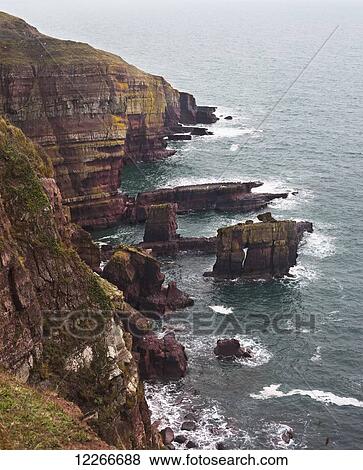 Coastal cliffs along the Pembrokeshire Coastal Path, near to Stackpole Quay; Wales View Large Photo Image Stock Photo - Coastal cliffs along the Pembrokeshire Coastal Path, near to Stackpole Quay; Wales. Fotosearch