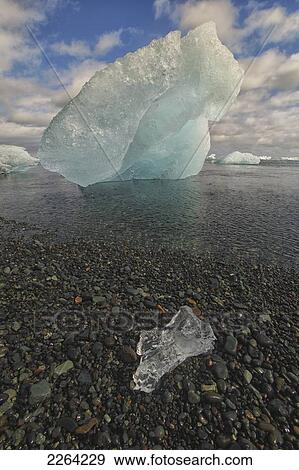 Stock Photo - Coastal iceberg in the atlantic ocean; iceland. Fotosearch