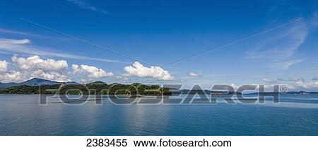 Stock Photography - Coastline with blue sky and blue ocean water; Costa Rica. Fotosearch