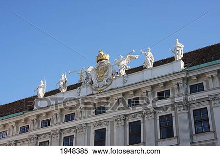 Stock Photography - Coat of arms atop the Reichkanzeleitrakt in the Hofburg Imperial Palace, Vienna (Wien), Austria. Fotosearch
