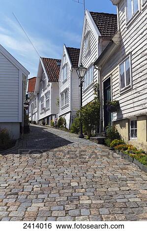 Stock Photograph - Cobblestone path in a residential neighbourhood; Stavanger, Norway. Fotosearch