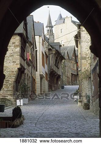 Stock Image - Cobblestone Street Under Archway At Dinan Rue Du Jerzual. Fotosearch