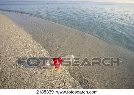 COCA COLA BOTTLE WASHED UP ON TROPICAL BEACH View Large Photo Image Stock Photo - COCA COLA BOTTLE WASHED UP ON TROPICAL BEACH. Fotosearch