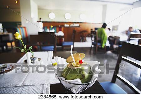 Stock Photography - Coconut milk drink beautifully presented at a breakfast buffet at top-rated five star Peerless Inn Hotel; Calcutta, West Bengal State, India. Fotosearch