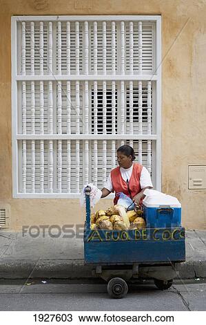 Stock Image - Coconut Water Seller In The Street. Fotosearch