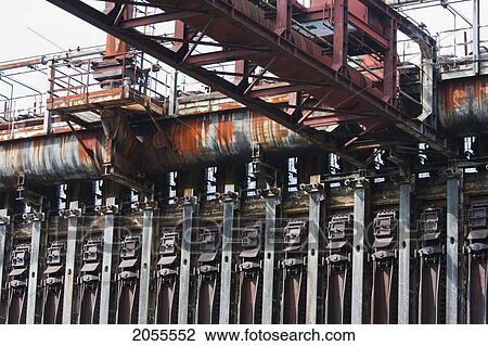 Coke Furnaces And Sun Wheel At The Zollverein Coking Plant, Essen, North Rhine-Westphalia, Germany View Large Photo Image Stock Image - Coke Furnaces And Sun Wheel At The Zollverein Coking Plant, Essen, North Rhine-Westphalia, Germany. Fotosearch