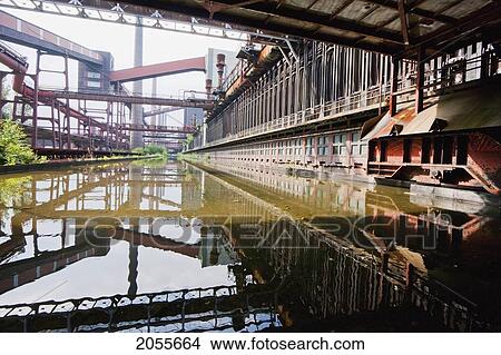 Picture - Coke Ovens Reflected In The Pool Of The Zollverein Coking Plant, Essen, North Rhine-Westphalia, Germany. Fotosearch