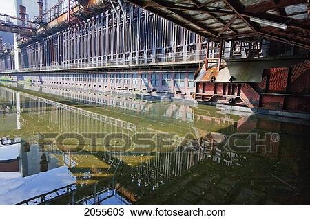 Coke Ovens Reflected In The Pool Of The Zollverein Coking Plant, Essen, North Rhine-Westphalia, Germany View Large Photo Image Stock Image - Coke Ovens Reflected In The Pool Of The Zollverein Coking Plant, Essen, North Rhine-Westphalia, Germany. Fotosearch