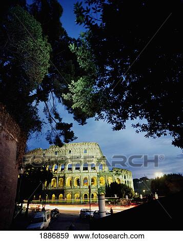Stock Photo - Coliseum At Night With Traffic Passing, Blurred Motion. Fotosearch