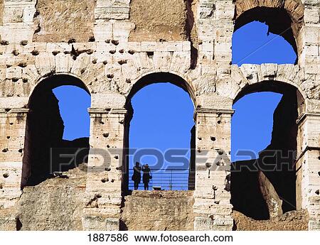 Colloseum With Silhouette Of Two People View Large Photo Image Stock Photograph - Colloseum With Silhouette Of Two People. Fotosearch