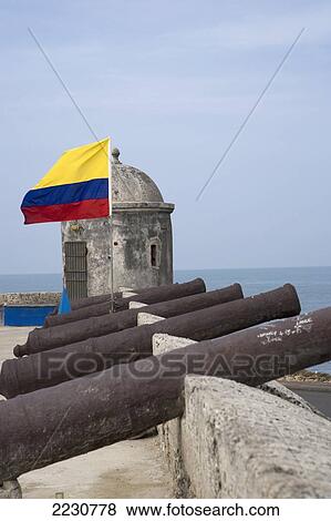 Stock Photo - Colombia, Canons And Colombian Flag On Old City Walls; Cartagena. Fotosearch