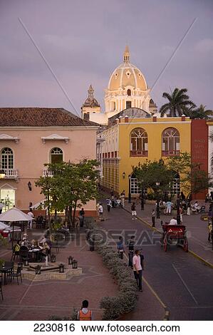 Stock Photograph - Colombia, View Of Cartagena After Sunset With Dome Of San Pedro Claver In Background; Cartagena. Fotosearch