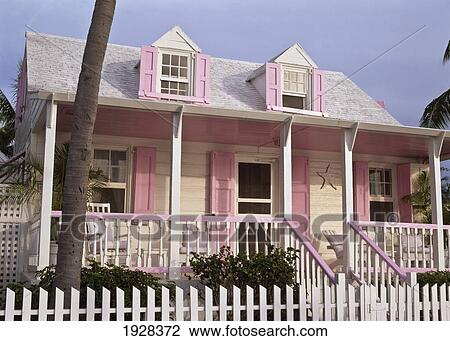 Stock Image - Colonial Style Pastel Painted House. Fotosearch