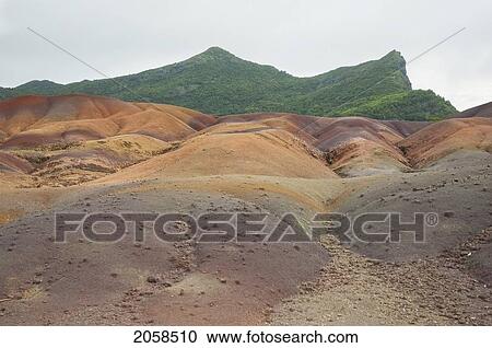 Colored Earths Of Chamarel. These Seven-Colored Dunes Are A Result From The Weathering Of Volcanic Rocks., Mauritius View Large Photo Image Stock Image - Colored Earths Of Chamarel. These Seven-Colored Dunes Are A Result From The Weathering Of Volcanic Rocks., Mauritius. Fotosearch