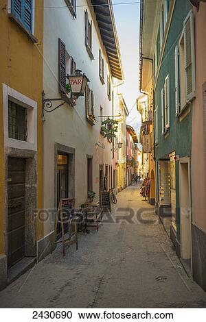 Stock Image - Colorful architecture along a narrow alleyway; Ascona, Ticino, Switzerland. Fotosearch