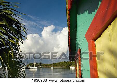 Colorful Building, Palm Tree, And Boats At True Blue Bay Resort; Grenada, Caribbean View Large Photo Image Stock Image - Colorful Building, Palm Tree, And Boats At True Blue Bay Resort; Grenada, Caribbean. Fotosearch