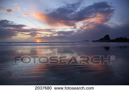 Colorful Cloud Reflections On The Beach At Cox Bay At Sunset Near Tofino; British Columbia Canada View Large Photo Image Stock Image - Colorful Cloud Reflections On The Beach At Cox Bay At Sunset Near Tofino; British Columbia Canada. Fotosearch
