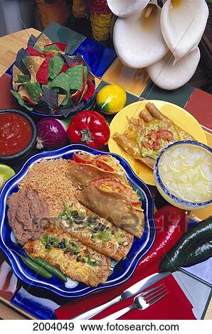 Colorful Display Of Mexican Food, Chips Salsa Enchilada Taco Flautas Refried Beans Rice Taquito View Large Photo Image Stock Photo - Colorful Display Of Mexican Food, Chips Salsa Enchilada Taco Flautas Refried Beans Rice Taquito. Fotosearch