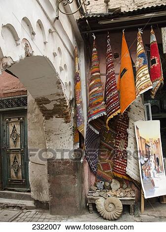 Stock Photo - Colorful fabric and rugs for sale; Medina, Marrakech, Morocco. Fotosearch