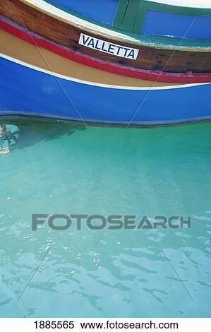 Stock Photography - Colorful Painted Boat In Harbor In Malta, Close-Up. Fotosearch