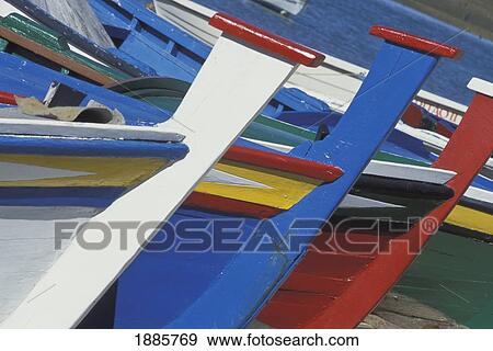 Stock Photo - Colorful Painted Boats Lined Up. Fotosearch