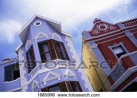Stock Photograph - Colorful Painted Colonial Houses, Low Angle View. Fotosearch