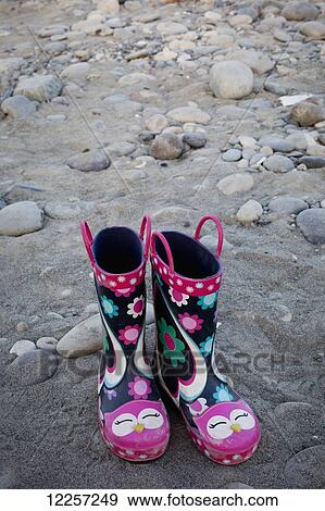 Colorful pink boots at the Peg Leg beach; Chilliwack, British Columbia, Canada View Large Photo Image Stock Photo - Colorful pink boots at the Peg Leg beach; Chilliwack, British Columbia, Canada. Fotosearch