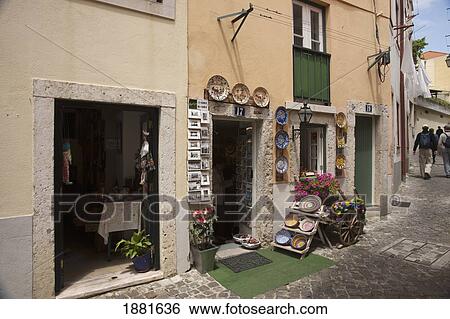 Stock Photograph - Colorful Pottery On Display On The Street Outside A Shop; Lisbon, Portugal. Fotosearch