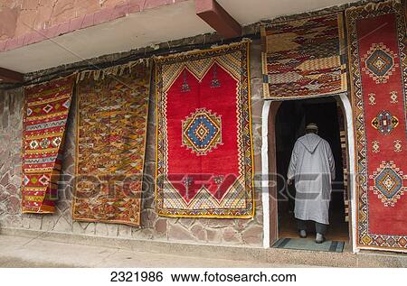 Colorful rugs hanging on display outside shop; Morocco View Large Photo Image Stock Photograph - Colorful rugs hanging on display outside shop; Morocco. Fotosearch