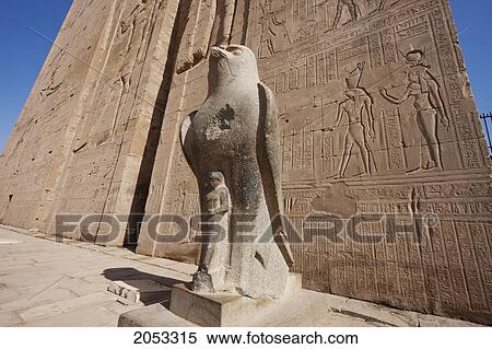 Colossal Black Granite Statue Of Horus As A Falcon In Front Of The Entrance Pylon Of The Temple Of Horus At Edfu, Aswan, Egypt View Large Photo Image Stock Photography - Colossal Black Granite Statue Of Horus As A Falcon In Front Of The Entrance Pylon Of The Temple Of Horus At Edfu, Aswan, Egypt. Fotosearch