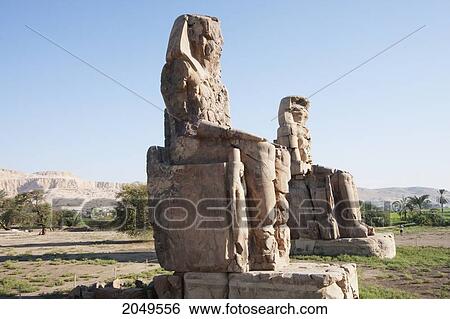 Colossi Of Memnon (Two Massive Stone Statues Of Pharaoh Amenhotep Iii), Western Thebes, Qina, Egypt View Large Photo Image Stock Photograph - Colossi Of Memnon (Two Massive Stone Statues Of Pharaoh Amenhotep Iii), Western Thebes, Qina, Egypt. Fotosearch