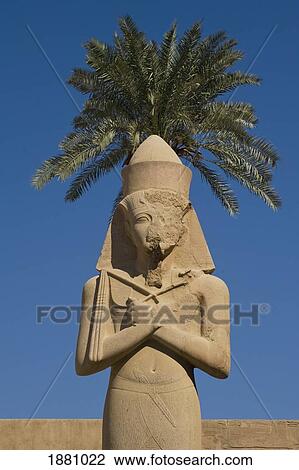 Stock Image - Colossus Of Ramses Ii In Front Of Date Palm. Fotosearch
