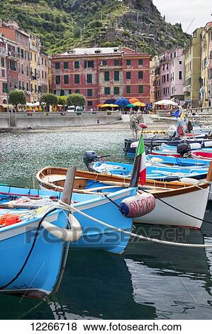 Stock Photo - Colourful boats in the harbour; Vernazza, Liguria, Italy. Fotosearch