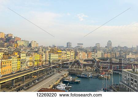 Colourful buildings along the waterfront and boats in the harbour; Genoa, Liguria, Italy View Large Photo Image Stock Image - Colourful buildings along the waterfront and boats in the harbour; Genoa, Liguria, Italy. Fotosearch