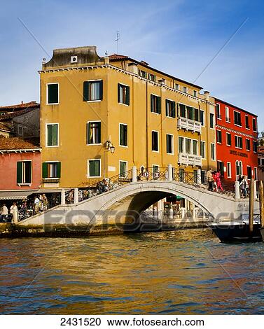 Colourful buildings and a bridge over a canal; Venice, Italy View Large Photo Image Stock Image - Colourful buildings and a bridge over a canal; Venice, Italy. Fotosearch