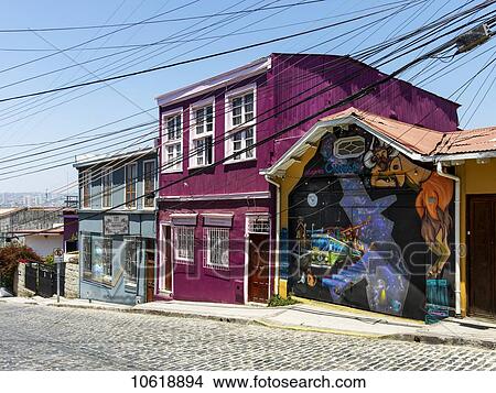 Colourful buildings and a mural painted on a wall; Valparaiso, Chile View Large Photo Image Picture - Colourful buildings and a mural painted on a wall; Valparaiso, Chile. Fotosearch