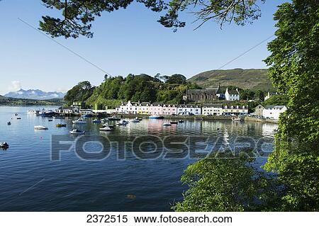Stock Photography - Colourful buildings and boats in the harbour; Portree, Skye, Scotland. Fotosearch