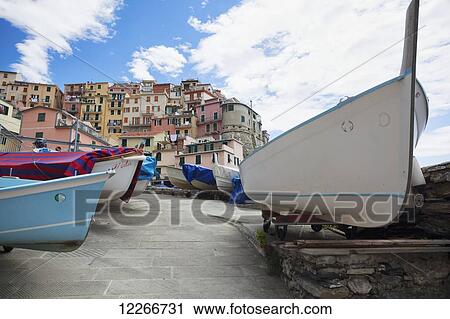 Colourful buildings and boats on the shore; Manarola, Liguria, Italy View Large Photo Image Stock Image - Colourful buildings and boats on the shore; Manarola, Liguria, Italy. Fotosearch