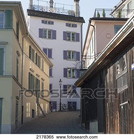 Colourful Buildings On A Narrow Street; Zurich Switzerland View Large Photo Image Stock Photography - Colourful Buildings On A Narrow Street; Zurich Switzerland. Fotosearch
