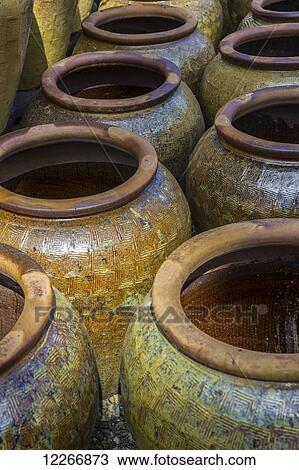 Stock Image - Colourful Clay pottery artisan products for sale in a craft market; Coombs, British Columbia, Canada. Fotosearch