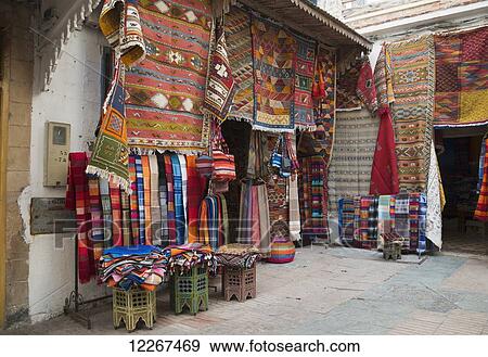 Stock Photo - Colourful display of rugs and blankets; Essaouira, Morocco. Fotosearch