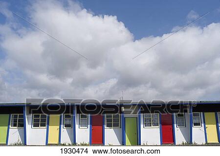 Colourful doorways in a row in Brighstone Holiday Centre; Isle of Wight, England View Large Photo Image Picture - Colourful doorways in a row in Brighstone Holiday Centre; Isle of Wight, England. Fotosearch