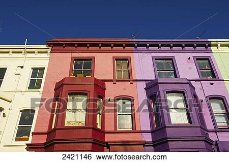 Stock Photograph - Colourful facades of residential buildings in a row, Notting Hill; London, England. Fotosearch