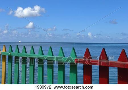 Stock Image - Colourful Fence In Front Of The Ocean; Grenada, Caribbean. Fotosearch